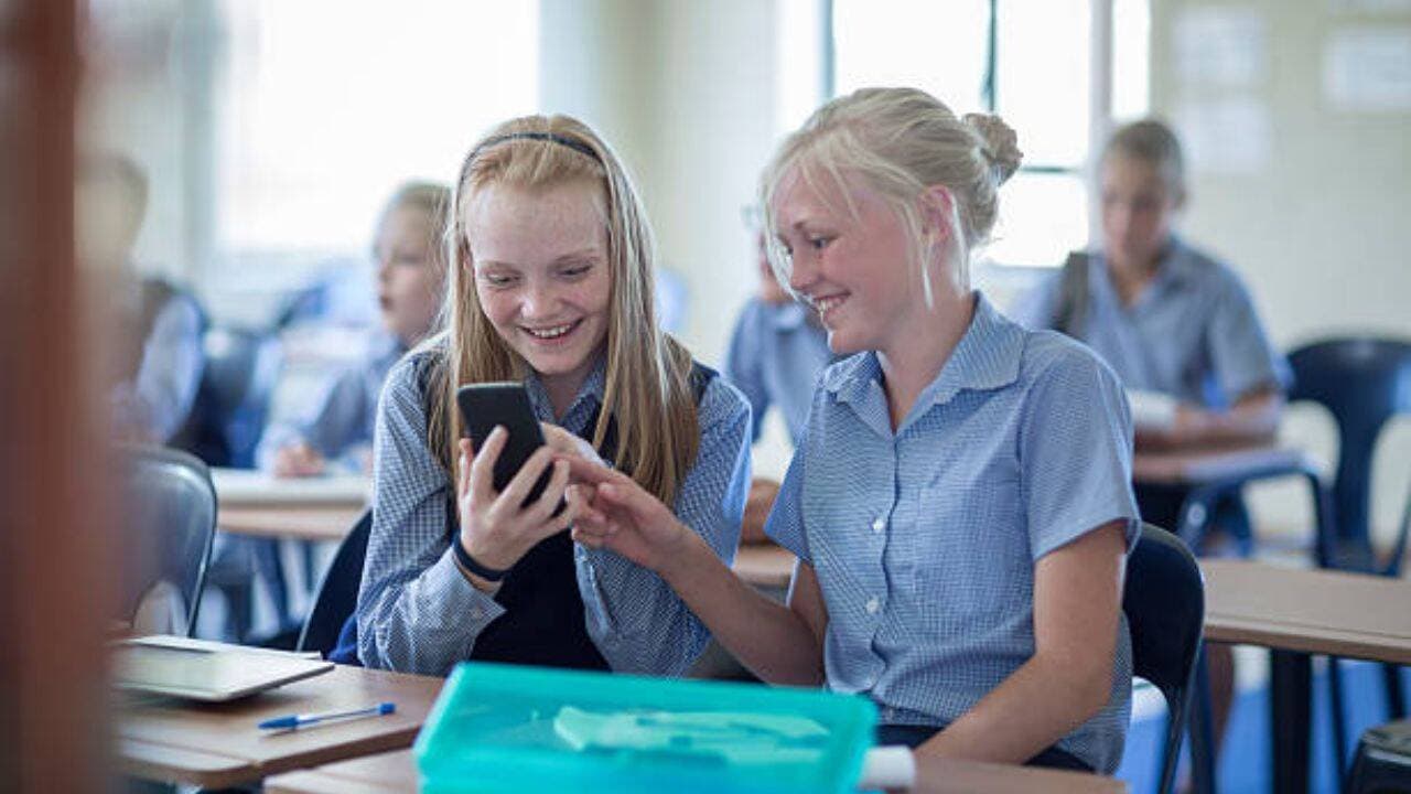 A new Kansas law now bars students from accessing phones, earbuds and smartwatches all school day